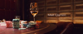 Movie still from “Ocean's Twelve” (2004), directed by Steven Soderbergh – A glass of wine on the table with poker chips on it; Extreme Close Up shot, Overhead angle