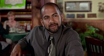 Movie still from “Office Space” (1999), directed by Mike Judge – A person wearing a shirt and a tie; Close Up shot, Low angle