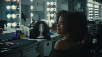 Movie still from “Atlanta” (2016), created by Donald Glover – A woman sitting in front of a mirror in a salon; Close Up shot, Over the shoulder angle