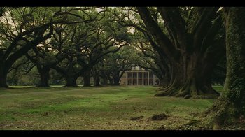 Movie still from “Atlanta” (2016), created by Donald Glover – A large house in the middle of a forest of trees; Extreme Wide shot, Low angle