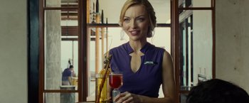 Movie still from “Old” (2021), directed by M. Night Shyamalan – A beautiful woman holding a glass of red wine; Close Up shot, Low angle