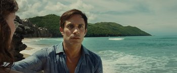 Movie still from “Old” (2021), directed by M. Night Shyamalan – A person near a body of water; Close Up shot, Over the shoulder angle