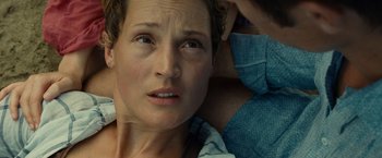 Movie still from “Old” (2021), directed by M. Night Shyamalan – A woman's face as she stares into the camera; Close Up shot, High angle