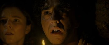 Movie still from “Old” (2021), directed by M. Night Shyamalan – A man's face in the dark; Close Up shot, Low angle