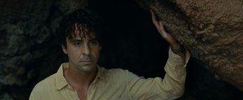 Movie still from “Old” (2021), directed by M. Night Shyamalan – A person holding a rock; Close Up shot, Low angle