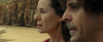 Movie still from “Old” (2021), directed by M. Night Shyamalan – A person looking up at something; Close Up shot, Over the shoulder angle