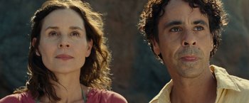 Movie still from “Old” (2021), directed by M. Night Shyamalan – A man and a woman standing next to each other; Close Up shot, Low angle