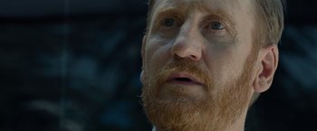 Movie still from “Old” (2021), directed by M. Night Shyamalan – A person with a beard; Extreme Close Up shot, Low angle