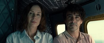 Movie still from “Old” (2021), directed by M. Night Shyamalan – A man and a woman sitting next to each other in a vehicle; Close Up shot, Low angle