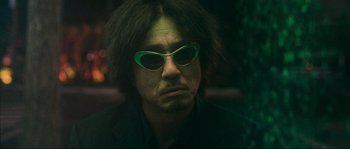 Movie still from “Oldboy” (2003), directed by Park Chan-wook – A person wearing sunglasses; Close Up shot, Low angle