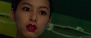 Movie still from “Oldboy” (2003), directed by Park Chan-wook – A woman's face with red lipstick; Close Up shot, Overhead angle
