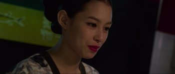 Movie still from “Oldboy” (2003), directed by Park Chan-wook – A person with a flower in her hair; Close Up shot, Over the shoulder angle