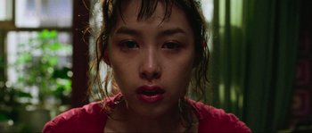 Movie still from “Oldboy” (2003), directed by Park Chan-wook – A person with wet hair; Close Up shot, Low angle