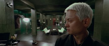 Movie still from “Oldboy” (2003), directed by Park Chan-wook – A man with a white hair sitting in a living room; Close Up shot, High angle