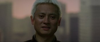 Movie still from “Oldboy” (2003), directed by Park Chan-wook – A person with a white hair; Close Up shot, Low angle