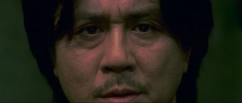 Movie still from “Oldboy” (2003), directed by Park Chan-wook – A man's eyes and face; Extreme Close Up shot, Low angle