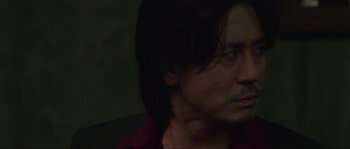 Movie still from “Oldboy” (2003), directed by Park Chan-wook – A person with long black hair; Close Up shot, Low angle