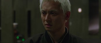 Movie still from “Oldboy” (2003), directed by Park Chan-wook – A person with white hair; Close Up shot, Low angle
