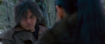 Movie still from “Oldboy” (2003), directed by Park Chan-wook – A man in a brown jacket talking to another man in a brown jacket; Close Up shot, Over the shoulder angle