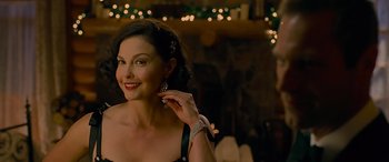 Movie still from “Olympus Has Fallen” (2013), directed by Antoine Fuqua – A woman in a black dress with a smile on her face; Close Up shot, Over the shoulder angle