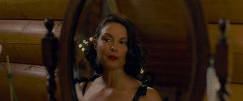 Movie still from “Olympus Has Fallen” (2013), directed by Antoine Fuqua – A woman in a black dress with red lipstick; Close Up shot, Over the shoulder angle