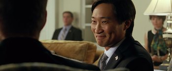 Movie still from “Olympus Has Fallen” (2013), directed by Antoine Fuqua – A man in a suit and tie sitting next to another man in a suit and tie; Close Up shot, Over the shoulder angle