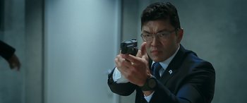 Movie still from “Olympus Has Fallen” (2013), directed by Antoine Fuqua – A man taking a picture of himself in a mirror; Close Up shot, Low angle