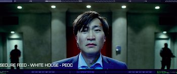 Movie still from “Olympus Has Fallen” (2013), directed by Antoine Fuqua – A person wearing a suit and tie; Close Up shot, Overhead angle