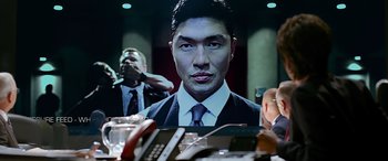 Movie still from “Olympus Has Fallen” (2013), directed by Antoine Fuqua – A man in a business suit is reflected in a mirror; Close Up shot, Over the shoulder angle