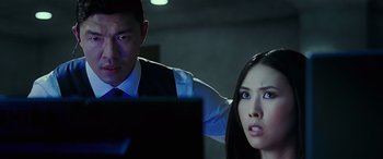 Movie still from “Olympus Has Fallen” (2013), directed by Antoine Fuqua – A man and a woman looking at a computer screen; Close Up shot, Over the shoulder angle