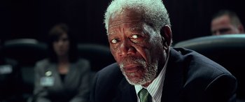 Movie still from “Olympus Has Fallen” (2013), directed by Antoine Fuqua – An older man wearing a suit and tie; Close Up shot, Low angle