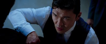 Movie still from “Olympus Has Fallen” (2013), directed by Antoine Fuqua – A person wearing a suit and tie; Close Up shot, Low angle