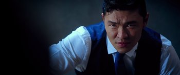 Movie still from “Olympus Has Fallen” (2013), directed by Antoine Fuqua – A person wearing a suit and tie; Close Up shot, Low angle