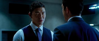 Movie still from “Olympus Has Fallen” (2013), directed by Antoine Fuqua – A man in a suit and tie talking to another man; Close Up shot, Over the shoulder angle