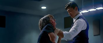 Movie still from “Olympus Has Fallen” (2013), directed by Antoine Fuqua – A man and a woman fighting in a room; Medium shot, Over the shoulder angle