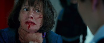 Movie still from “Olympus Has Fallen” (2013), directed by Antoine Fuqua – A person with blood all over her face; Close Up shot, Low angle