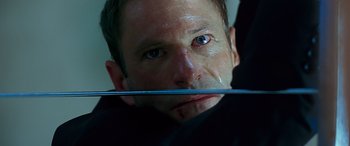 Movie still from “Olympus Has Fallen” (2013), directed by Antoine Fuqua – A person holding a knife in his mouth; Close Up shot, Low angle