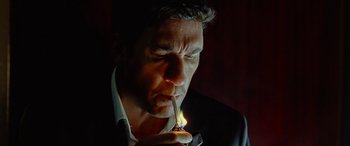 Movie still from “Olympus Has Fallen” (2013), directed by Antoine Fuqua – A person lighting a candle; Close Up shot, Low angle