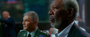 Movie still from “Olympus Has Fallen” (2013), directed by Antoine Fuqua – A man with a gray beard is looking into the distance; Close Up shot, Low angle