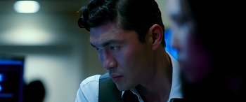 Movie still from “Olympus Has Fallen” (2013), directed by Antoine Fuqua – A person wearing a shirt and tie; Close Up shot, Over the shoulder angle