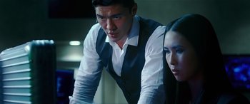 Movie still from “Olympus Has Fallen” (2013), directed by Antoine Fuqua – A man and a woman looking at a computer screen; Close Up shot, Low angle