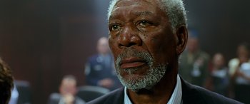 Movie still from “Olympus Has Fallen” (2013), directed by Antoine Fuqua – An older man with a gray beard looking into the distance; Close Up shot, Low angle