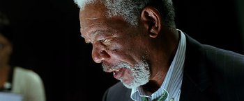 Movie still from “Olympus Has Fallen” (2013), directed by Antoine Fuqua – An older man with a gray beard is looking down; Close Up shot, Low angle