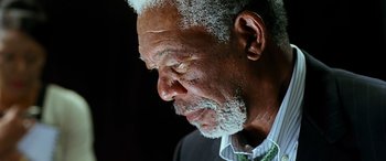 Movie still from “Olympus Has Fallen” (2013), directed by Antoine Fuqua – An older man with white hair looking down at his face; Close Up shot, Low angle