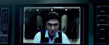 Movie still from “Olympus Has Fallen” (2013), directed by Antoine Fuqua – A man in a suit and tie in front of a mirror; Close Up shot, Over the shoulder angle