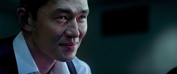 Movie still from “Olympus Has Fallen” (2013), directed by Antoine Fuqua – A person wearing a shirt and tie; Close Up shot, Low angle