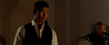 Movie still from “Olympus Has Fallen” (2013), directed by Antoine Fuqua – A man wearing a vest and a white shirt; Close Up shot, Over the shoulder angle