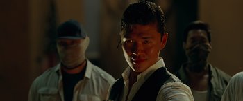 Movie still from “Olympus Has Fallen” (2013), directed by Antoine Fuqua – A man in a white shirt and a black vest; Close Up shot, Low angle