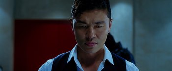 Movie still from “Olympus Has Fallen” (2013), directed by Antoine Fuqua – A person wearing a suit and tie; Close Up shot, Low angle