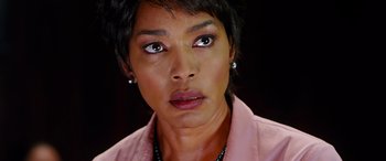 Movie still from “Olympus Has Fallen” (2013), directed by Antoine Fuqua – A person wearing a pink shirt; Close Up shot, Over the shoulder angle